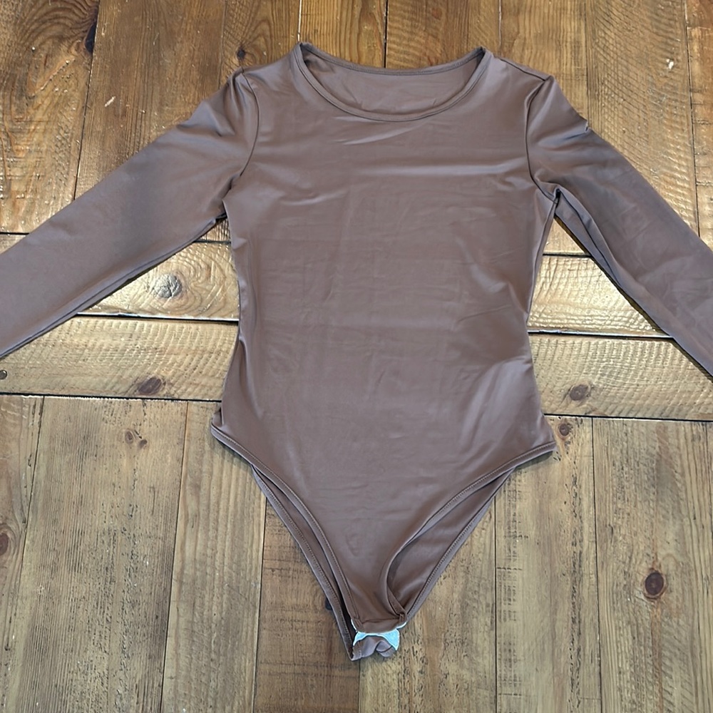 Brown body suit, size medium unworn, but with no tags